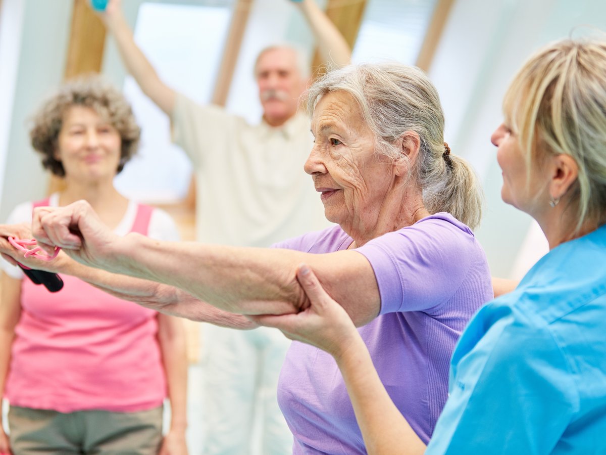 Seniors enjoying an exercise class at an adult day care in Lakeland, Florida