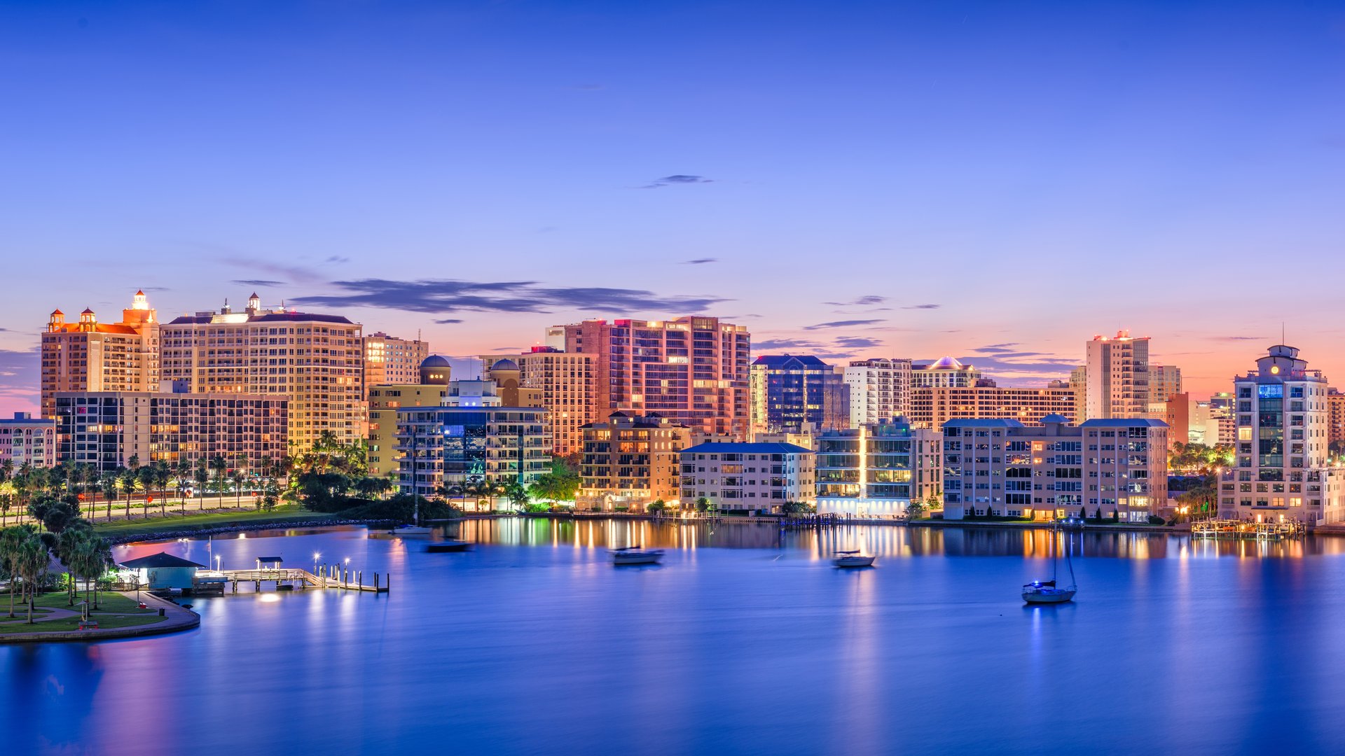 Skyline of Sarasota, Florida along the bay at sunset, representing local community for adult day care services.