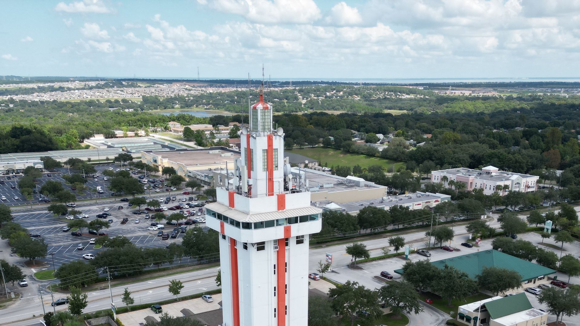 An aerial view of a tower in downtown Clermont, Florida, highlighting the city served by local adult day care centers.
